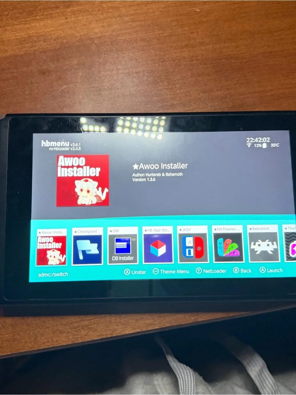 Nintendo Switch with Clear Shell and Pink Screen Artwork